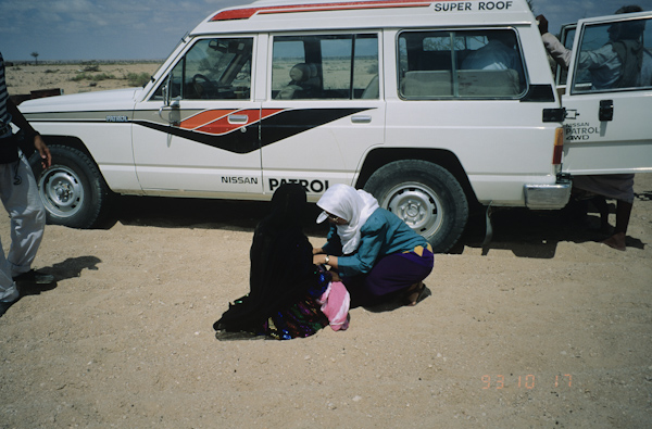 Seventh year medical students examining patient