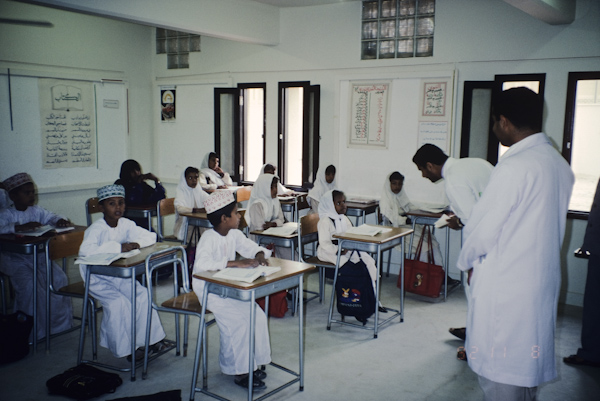 Seventh year medical students talking to primary school students